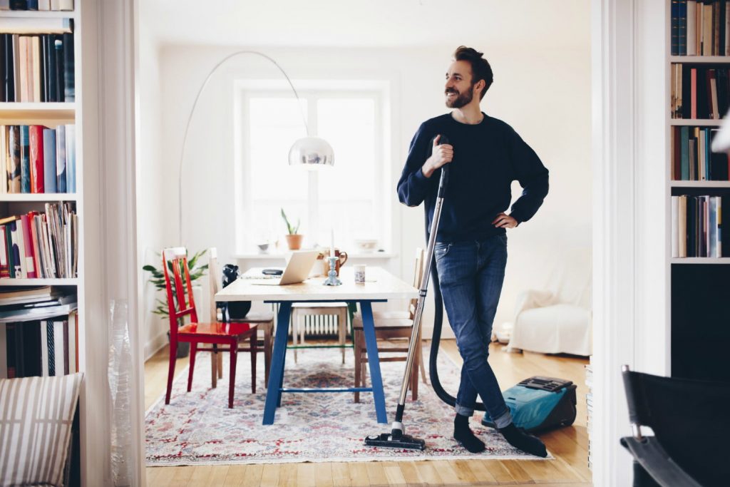 man cleaning his house