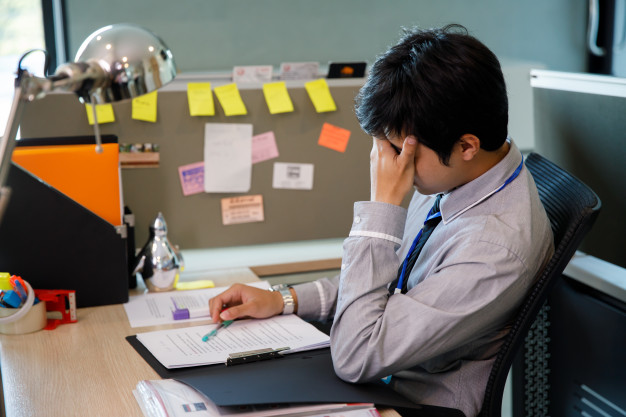 depressed man at workplace