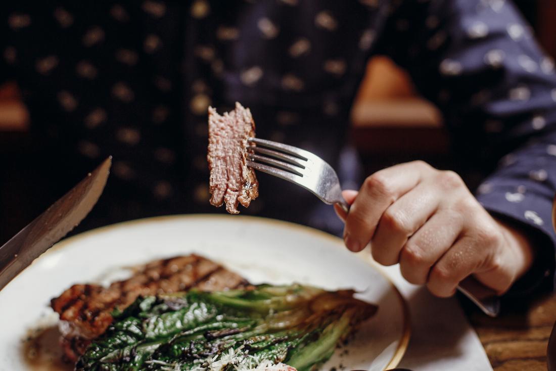 man eating meat; healthy lifestyle