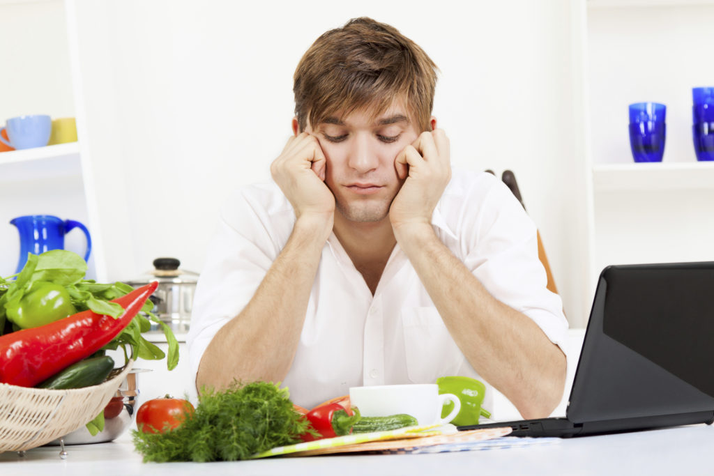 Frustrated man don't want eat vegetables