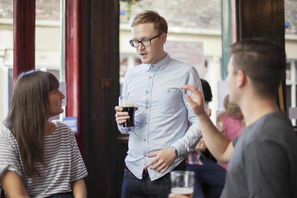 Young woman looking at man