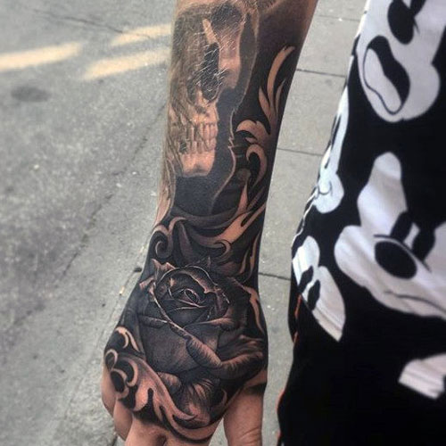 hand tattoos for men rose and skull