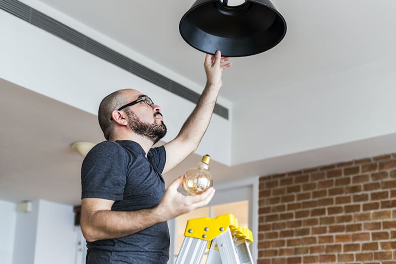 Man Changing Light Bulb 