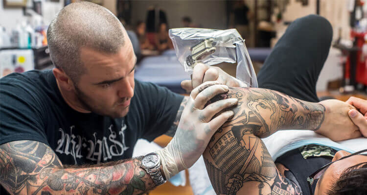 man getting tattoos