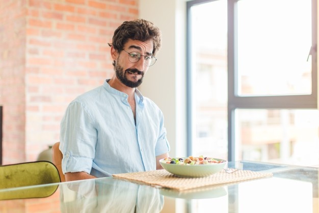 Bearded man looking puzzled and confused