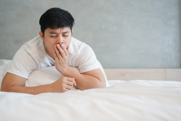 asian man yawning