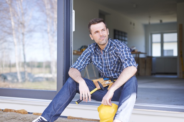 man sitting and staring at something