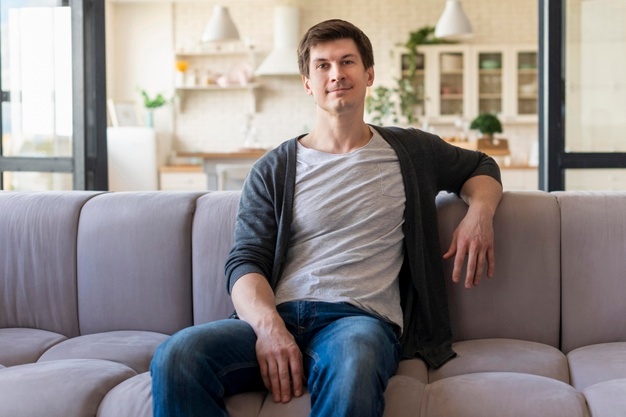  man sitting on couch