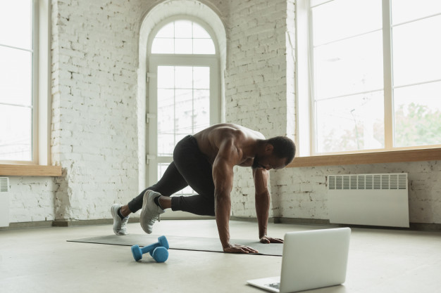 Young african-american man training at home