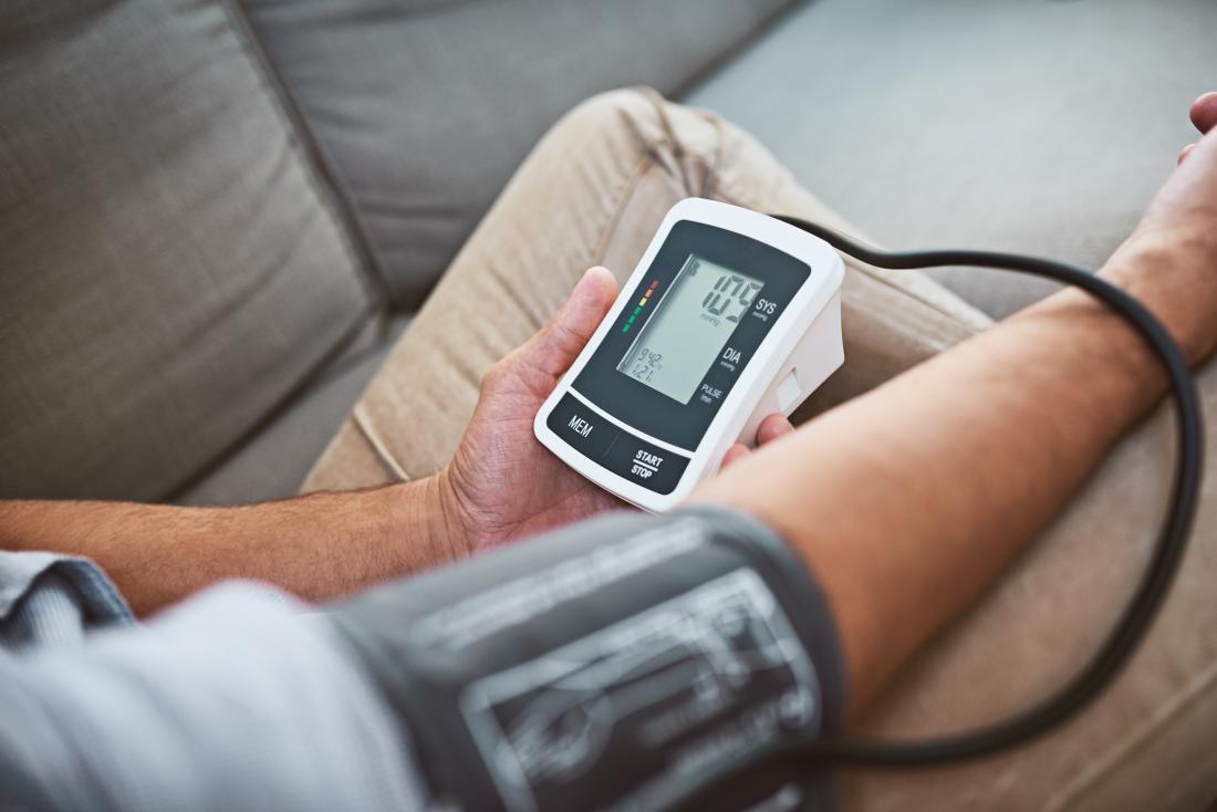 man checking his blood pressure- healthy lifestyle