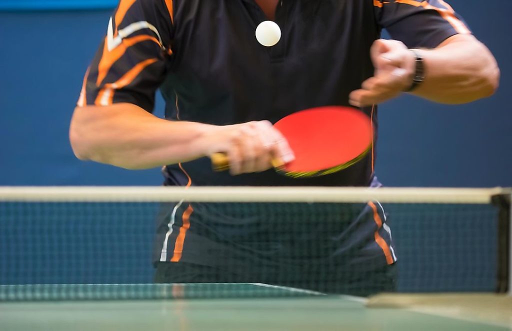 table tennis player serving