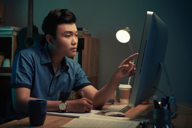 man learning at night