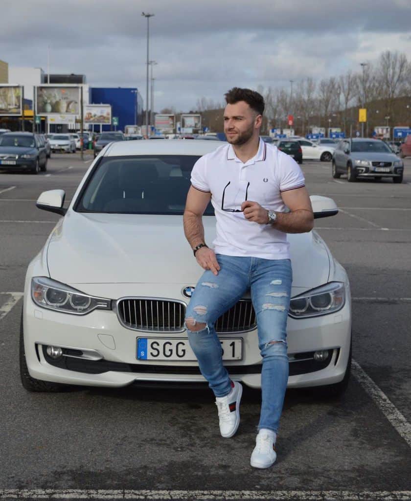 men in white shirt and jeans