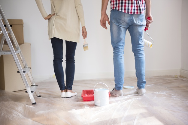 couple painting the wall