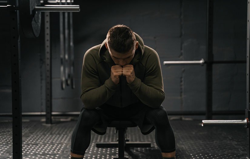 Depressed man sitting 