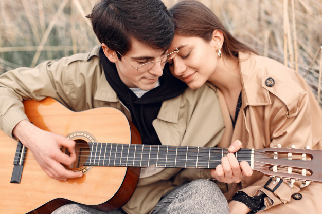 Beautiful couple spend time in an autumn