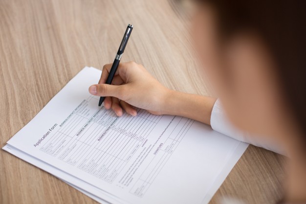 female applicant completing