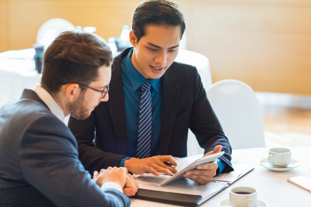 Two content business partners discussing issue