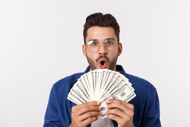 how to boost happiness for men; man holding money