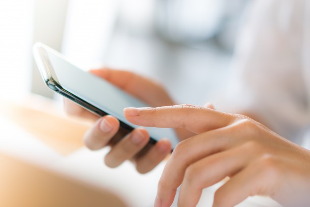 Business hand with mobile phone