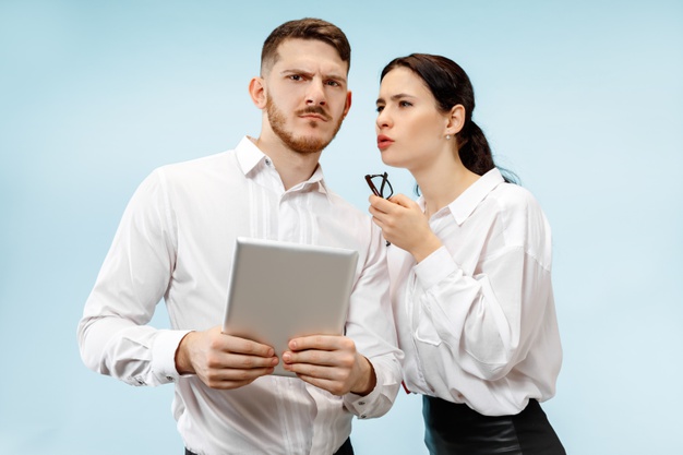 two co workers gossiping, how to deal with gossip; tips for men
