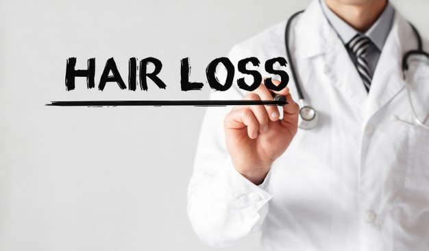 doctor-writing-word-hair-loss-with-marker-medical-concept