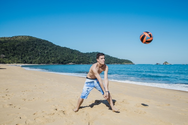 man playing volleyball; healthy lifestyle