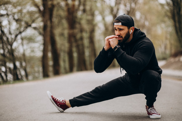 handsome-man-exercising-park-sports-wear