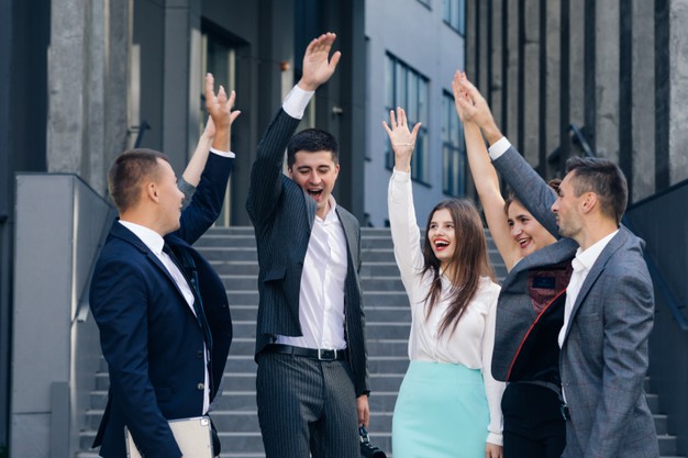 Happy leader motivate diverse employees business team give five together, office workers group and coach engaged in teambuilding celebrate success good results reward in teamwork