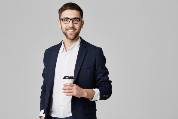 man holding coffee cup; benefits of drinking coffee for men