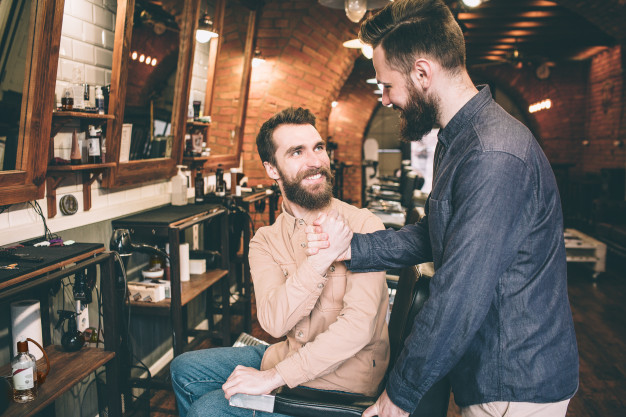 two-guys-are-shaking-each-other-s-hands-tey-are-happy-meet-barbershop