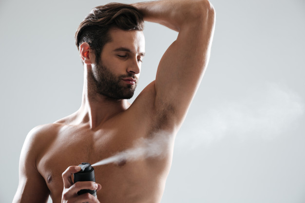 young-man-using-deodorant