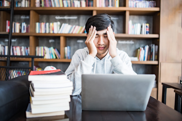 young-student-man-tired-computer-sitting-cafe-table-with-laptop