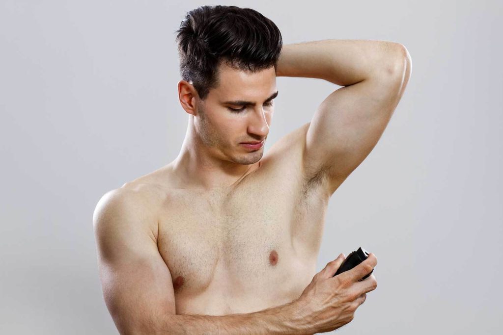 man applying roll-on