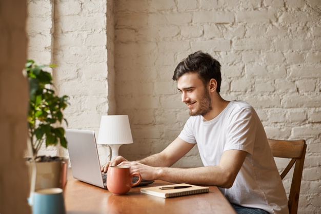 Attractive student uses internet technology and high speed wi-fi connection to chat with friend
