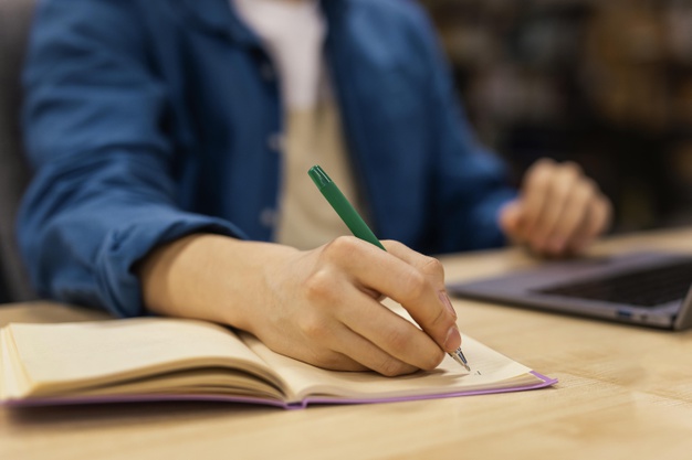 Boy studying in the university library 