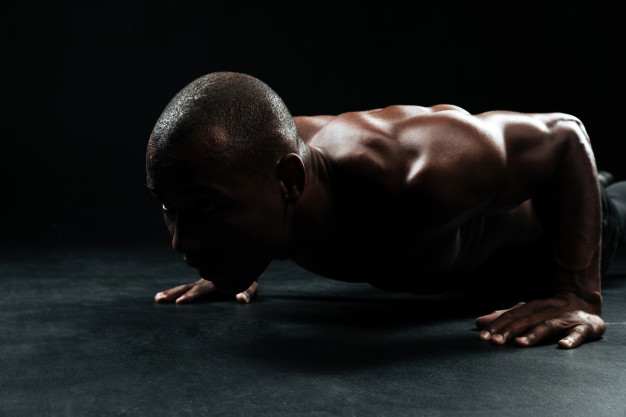 close-up-portrait-afro-american-sports-man-with-beautiful-muscular-body-doing-pushup-exercise-floor