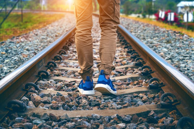 feet-male-walking-railroad-travel-concept