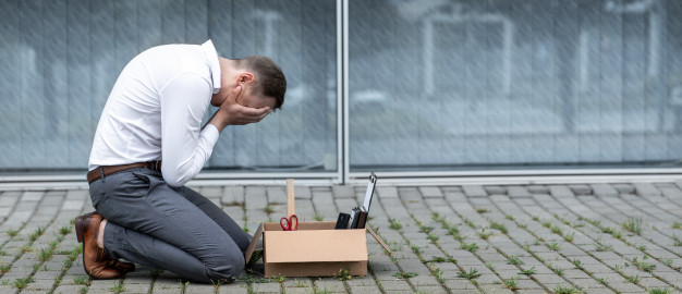 fired-office-worker-fell-his-knees-covered-his-face-due-stress-front-him-is-cardboard-box