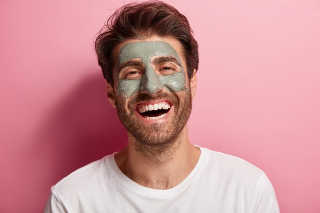 man smiling with face mask