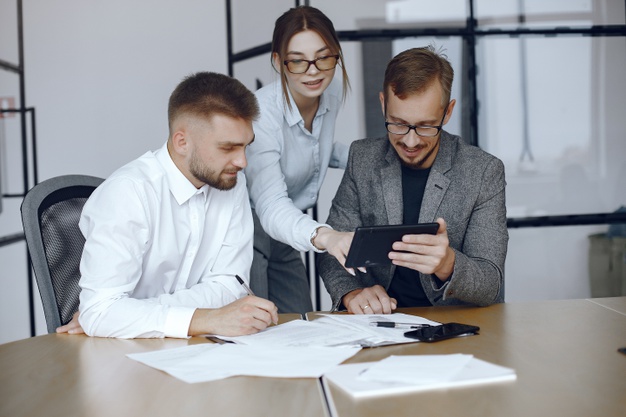Man with a tablet. business partners at a business meeting.people sitting at the table