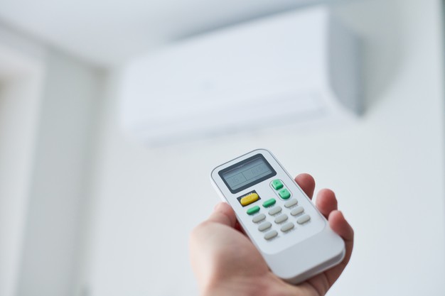 Remote control for air conditioner in hand