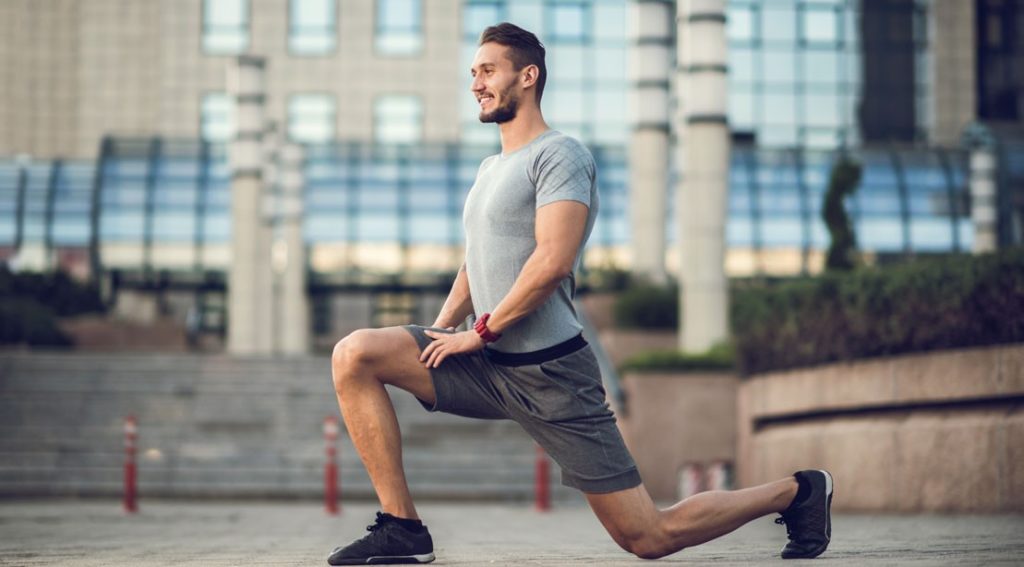 man making Walking Lunges