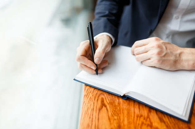 Business man write diary