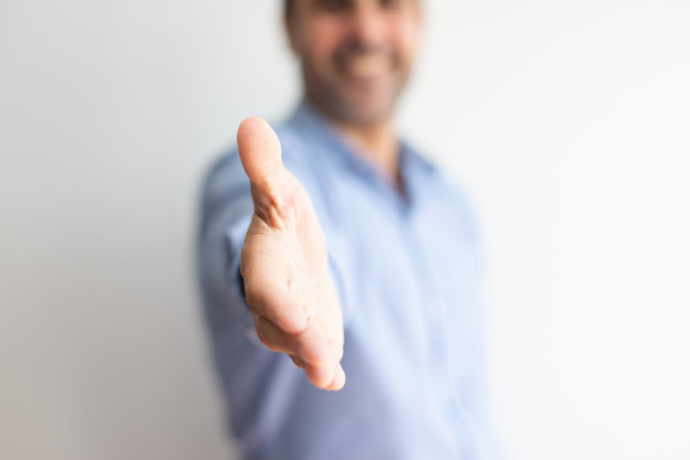 closeup-business-man-offering-hand-handshake