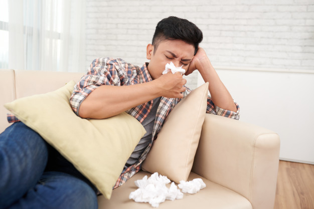 young-asian-man-suffering-runny-nose-having-medical-leave-staying-home