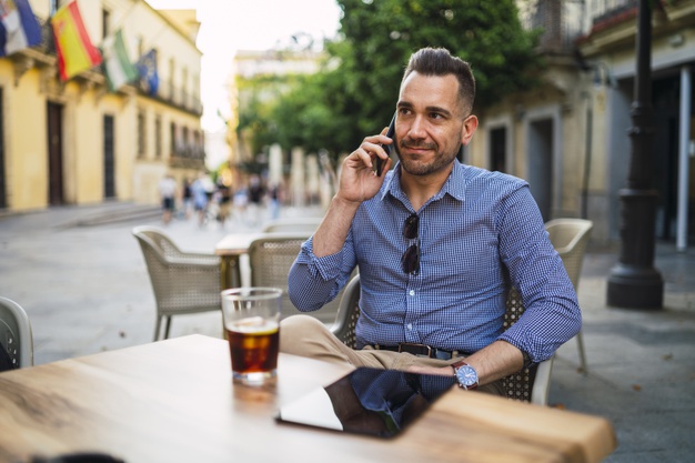  businessman in a formal outfit  talking on the phone 