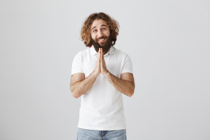  Thankful Young Man Keeping Hands On Chest 
