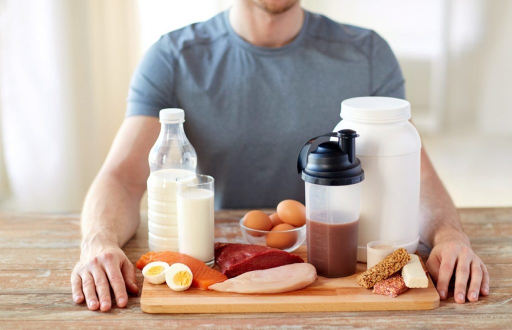Man holding protein rich foods for sports nutrition