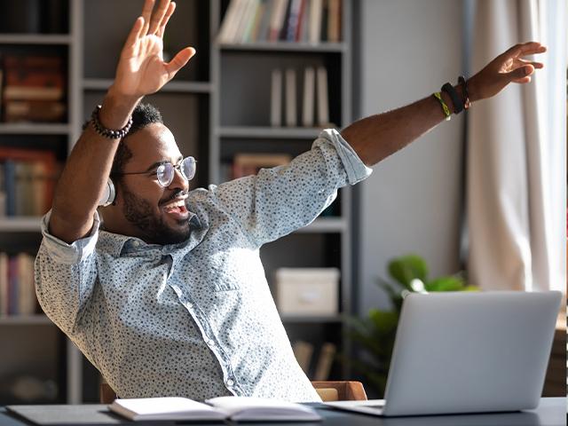 Happy Man Working With Laptop 
